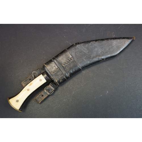 109 - A small vintage kukri knife, steel blade, two piece horn handle with bone panels, leather covered wo... 