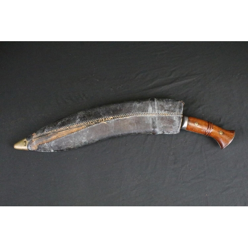 119 - A World War One / WW1 Gurkha Kukri knife, fullered steel blade, wooden two piece riveted handle with... 