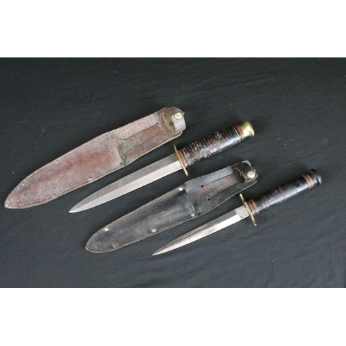 126 - Two vintage double edged hunting / scouting sheath knives, both Sheffield made to include a Aitkinso... 