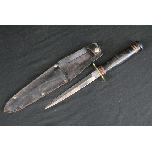 126 - Two vintage double edged hunting / scouting sheath knives, both Sheffield made to include a Aitkinso... 