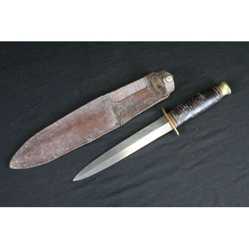 126 - Two vintage double edged hunting / scouting sheath knives, both Sheffield made to include a Aitkinso... 