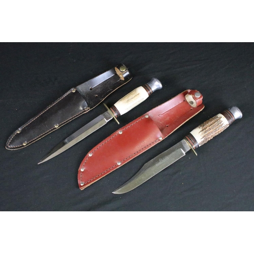 129 - Two vintage scouting / hunting knives, both having antler handles, brass hilts, aluminium pommels an... 