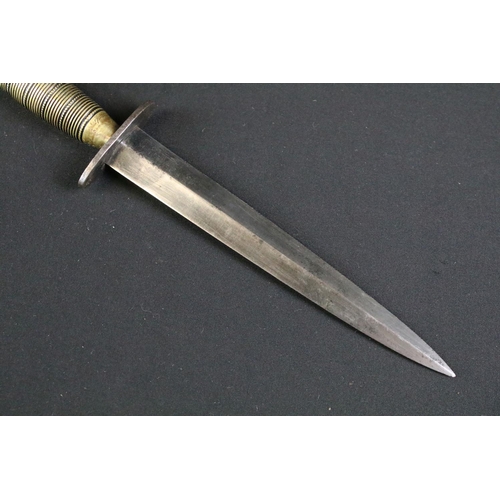 135 - A British World War Two Fairbairn sykes commando dagger, sterile with no markings complete with orig... 