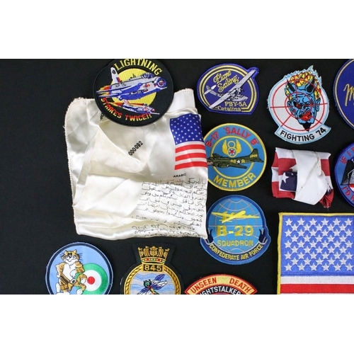 148 - A large collection of reproduction military and air force cloth badges and patches.