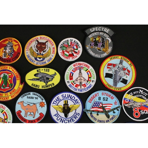 148 - A large collection of reproduction military and air force cloth badges and patches.