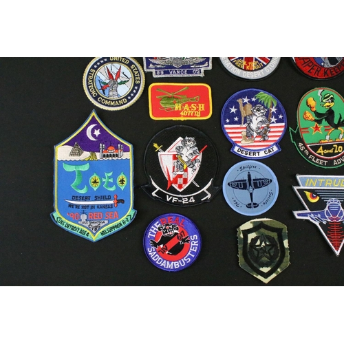 148 - A large collection of reproduction military and air force cloth badges and patches.