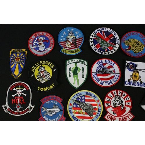 148 - A large collection of reproduction military and air force cloth badges and patches.