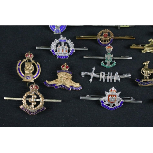 15 - A collection of nineteen British military regimental sweetheart brooches to include : Royal Armoured... 