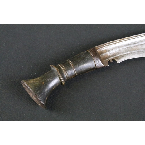 162 - An early to mid 20th century kukri knife, fullered blade, steel blade, horn handle, leather covered ... 