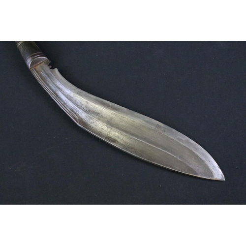 162 - An early to mid 20th century kukri knife, fullered blade, steel blade, horn handle, leather covered ... 