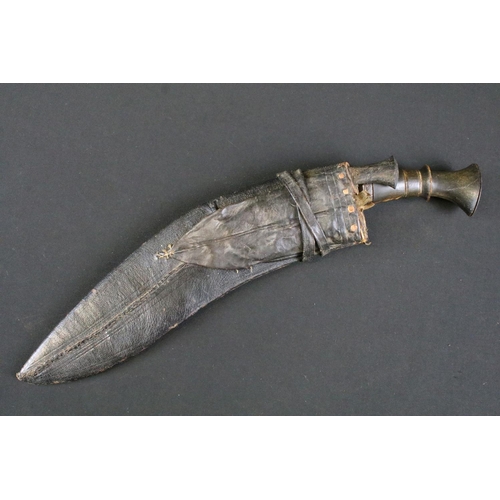 162 - An early to mid 20th century kukri knife, fullered blade, steel blade, horn handle, leather covered ... 