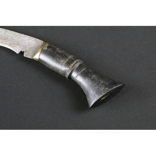 173 - A mid 20th century small Kukri knife, steel blade, carved horn handle with brass kanzo, blade measur... 