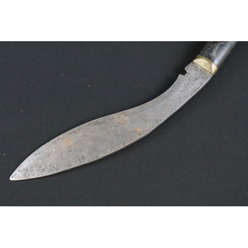 173 - A mid 20th century small Kukri knife, steel blade, carved horn handle with brass kanzo, blade measur... 