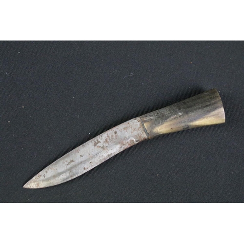 178 - A mid 20th century Kukri knife, steel blade with engraved decoration, turned horn handle, brass flat... 