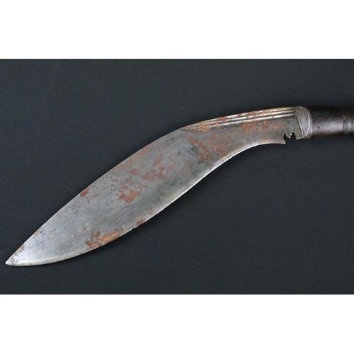 183 - An early to mid 20th century Kukri knife, steel triple groove fullered blade, turned wooden handle, ... 