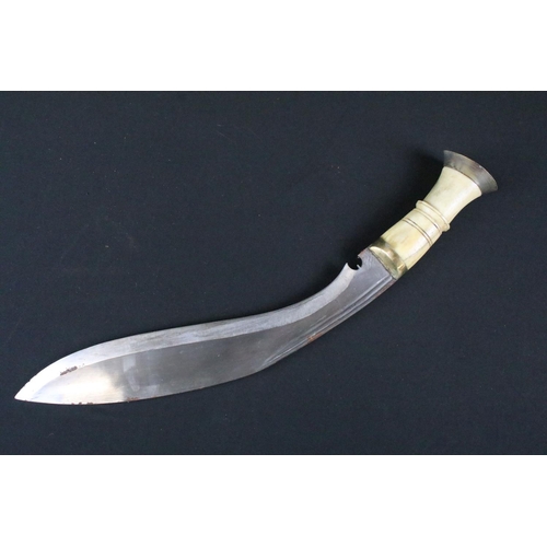 184 - A vintage early to mid 20th century Kukri knife, twin groove fullered steel blade, carved bone handl... 