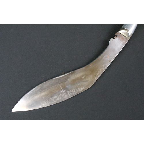 190 - A 20th century Kukri knife, steel blade with dot engraved decoration and marked India, aluminium han... 