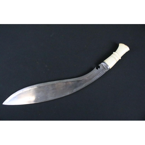 193 - An early to mid 20th century Kukri knife, twin groove fullered steel blade, turned bone handle, blad... 