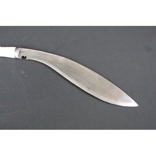 193 - An early to mid 20th century Kukri knife, twin groove fullered steel blade, turned bone handle, blad... 