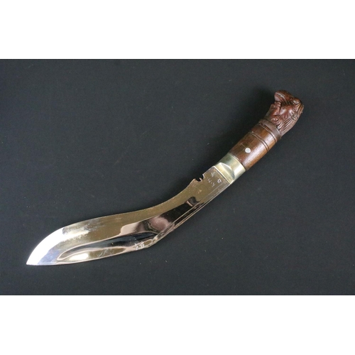 195 - A Garud Ang Khola (Dragon) Kukri knife, polished steel Chirra blade, blade signed K.M., nickle silve... 