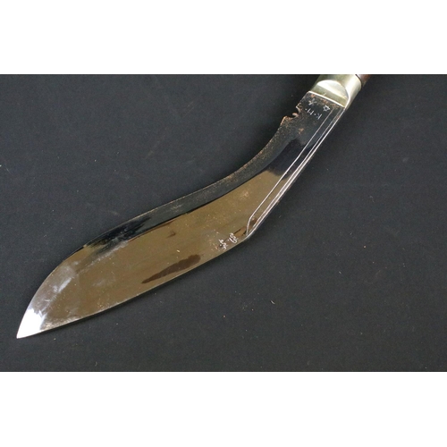 195 - A Garud Ang Khola (Dragon) Kukri knife, polished steel Chirra blade, blade signed K.M., nickle silve... 