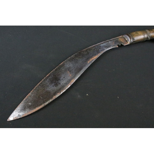 203 - A World War Two / WW2 military Kukri knife, steel blade marked 1945 Co 43 together with indistinct m... 