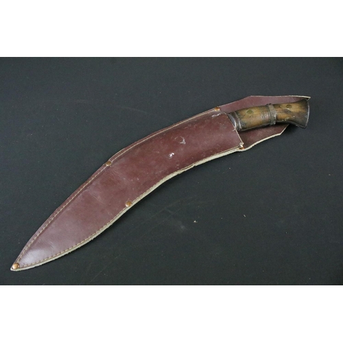 203 - A World War Two / WW2 military Kukri knife, steel blade marked 1945 Co 43 together with indistinct m... 