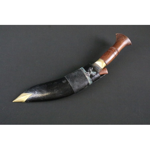 204 - A late 20th century small Kukri knife, steel blade with decorative engraving of dragon and birds, tu... 