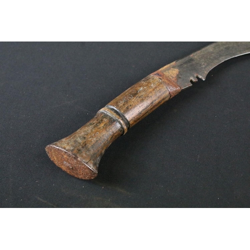 205 - An mid 20th century Kukri knife, steel blade with turned wooden handle, blade measures approx 31.5cm... 