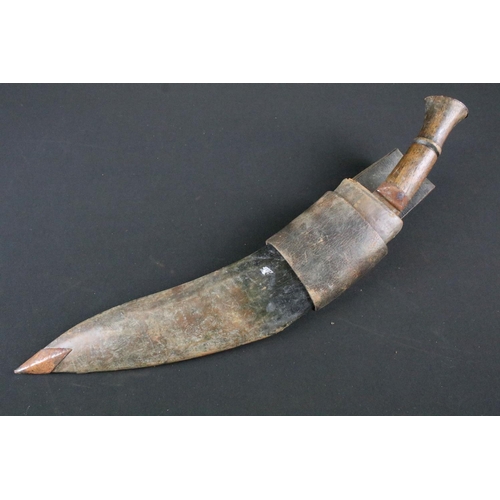 205 - An mid 20th century Kukri knife, steel blade with turned wooden handle, blade measures approx 31.5cm... 