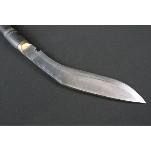 206 - A late 20th century Kukri knife, steel handle with single grooved blade, turned horn handle, brass p... 