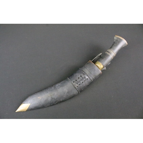 206 - A late 20th century Kukri knife, steel handle with single grooved blade, turned horn handle, brass p... 