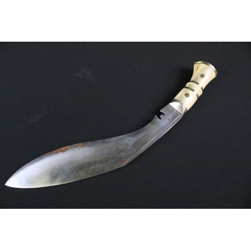 211 - A mid 20th century Chirra Kukri knife, steel blade with Chirra and grooved fullers, bone riveted han... 