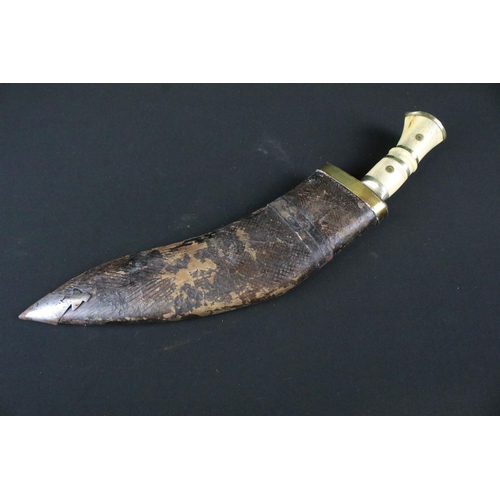 211 - A mid 20th century Chirra Kukri knife, steel blade with Chirra and grooved fullers, bone riveted han... 