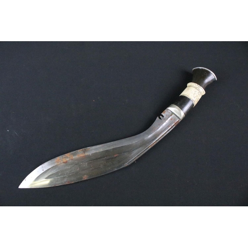 212 - A mid 20th century Chirra Kukri knife, steel blade with Chirra and grooved fullers, bone and horn ba... 