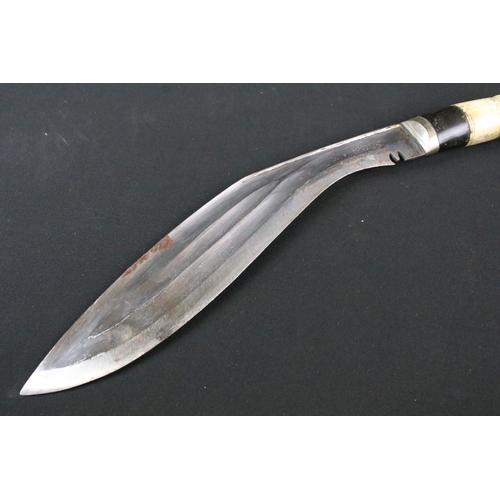 212 - A mid 20th century Chirra Kukri knife, steel blade with Chirra and grooved fullers, bone and horn ba... 