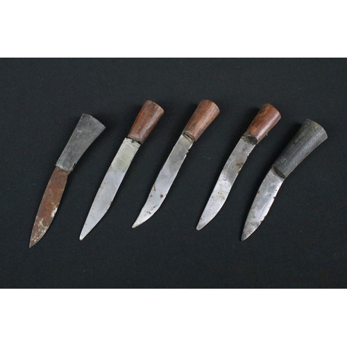 213 - A late 20th century Kukri knife, steel blade with twin grooved fullers, turned wooden handle, blade ... 