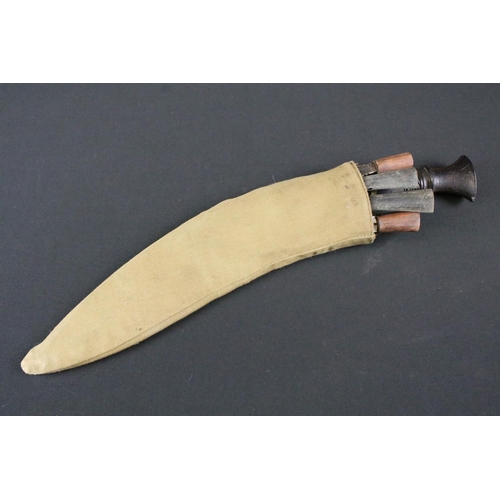 213 - A late 20th century Kukri knife, steel blade with twin grooved fullers, turned wooden handle, blade ... 