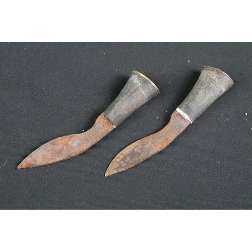 216 - A late 20th century small Kukri knife, engraved steel blade, turned wooden handle with brass fitting... 