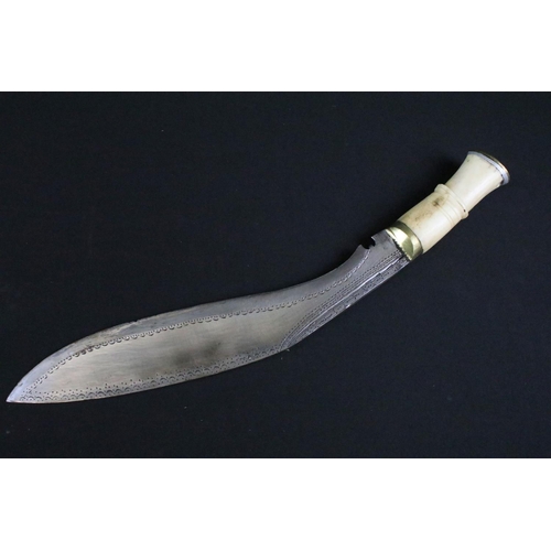 233 - A mid to late 20th century Kukri knife, steel blade with elaborate dot engraved decoration, turned b... 