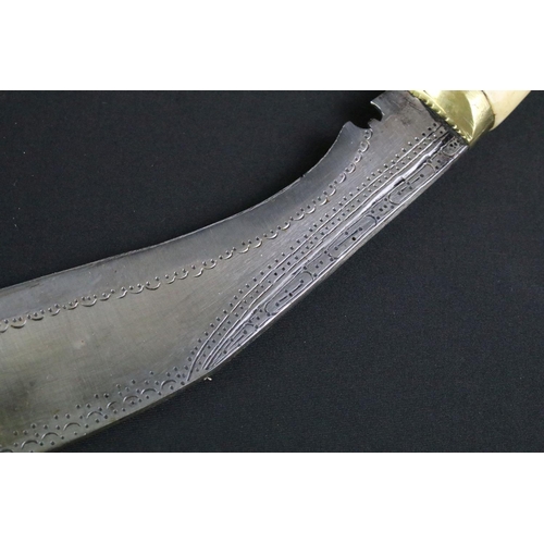 233 - A mid to late 20th century Kukri knife, steel blade with elaborate dot engraved decoration, turned b... 