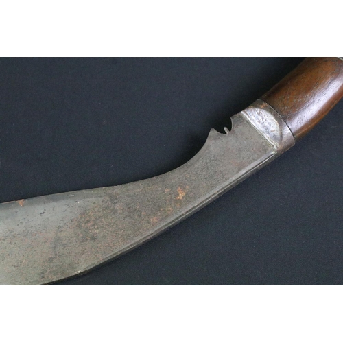 236 - A mid 20th century Kukri knife, steel blade with grooved fuller, turned wooden handle, blade measure... 