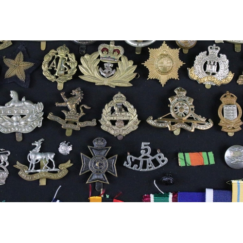 24 - A collection of mixed militaria to include a full size British World War Two / WW2 1939-1945 British... 