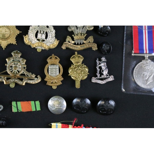 24 - A collection of mixed militaria to include a full size British World War Two / WW2 1939-1945 British... 