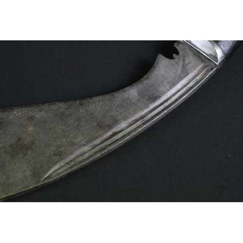 241 - A mid to late 20th century large Kukri knife, steel blade with twin grooved fullers, turned ebonised... 