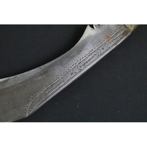 244 - A mid 20th century Kukri knife, steel blade with decorative dot engraving, turned bone handle, blade... 