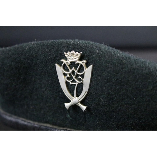 246 - A genuine NATO issued green military beret badged to the 7th Gurkha rifles.