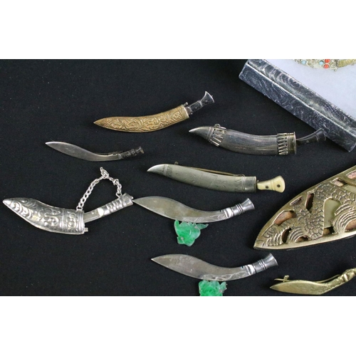 249 - A collection of Gurkha sweetheart brooches to include silver examples together with souvenir Kukri k... 