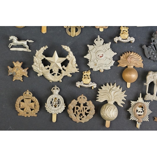 263 - A collection of approx fifty mainly British military regimental cap and collar badges to include the... 