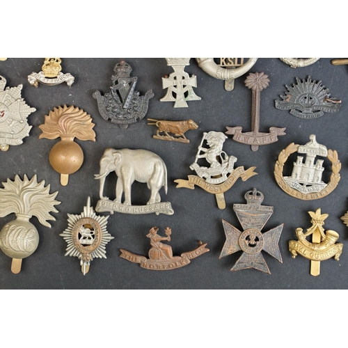 263 - A collection of approx fifty mainly British military regimental cap and collar badges to include the... 